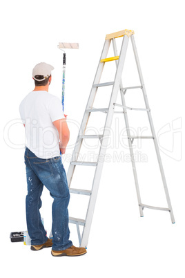 Handyman with paint roller and ladder