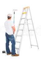 Handyman with paint roller and ladder
