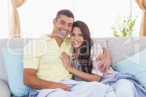 Romantic couple embracing in house