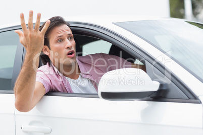 Young man experiencing road rage
