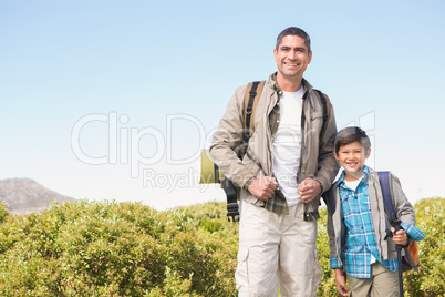 Father and son hiking in the mountains