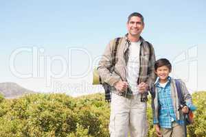 Father and son hiking in the mountains