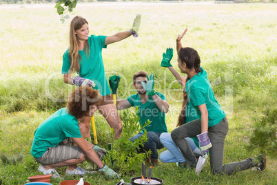 Happy friends gardening for the community