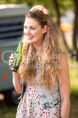 Pretty hipster drinking bottle of beer