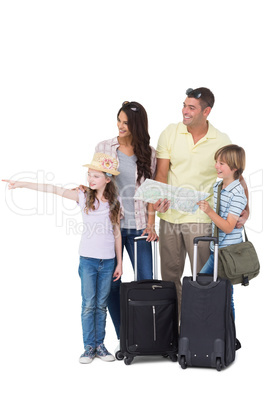 Family with bags looking away while girl pointing