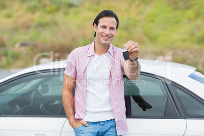 Man leaning on the door and holding key