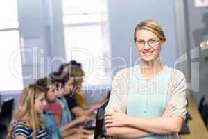 Confident female teacher in computer class