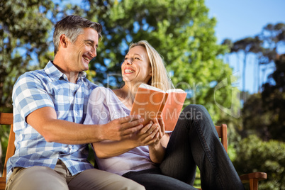 Couple relaxing in the park on bench