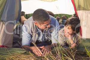 Father and son in their tent