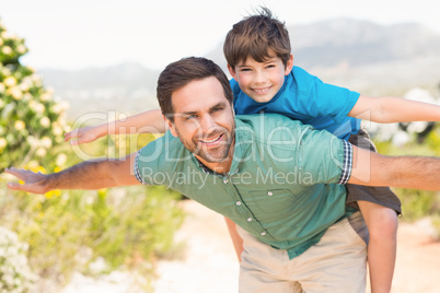 Father and son hiking through mountains