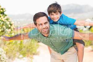 Father and son hiking through mountains