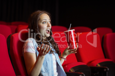 Young woman watching a film