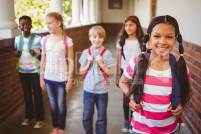 Smiling little school kids in school corridor