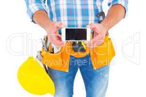 Midsection of repairman showing mobile phone