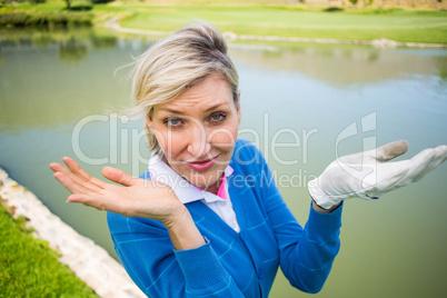 Worried female golfer looking for golf ball