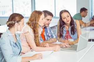 Fashion students taking notes in class