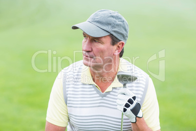 Golfer kneeling on the putting green