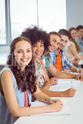 Fashion students taking notes in class