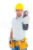 Portrait of handyman using power drill