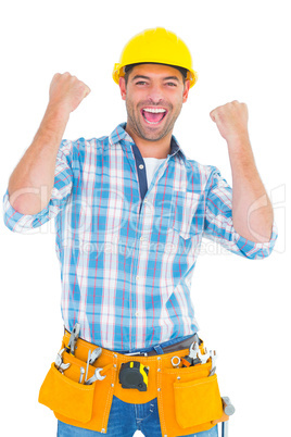 Excited manual worker clenching fists
