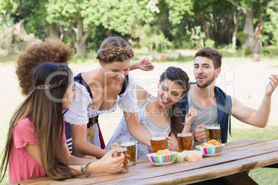 Pretty oktoberfest girl serving friends