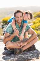 Father and son hiking through mountains