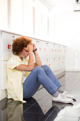 Tensed young man in office corridor