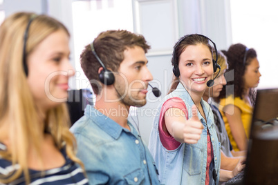 Students using headsets in computer class