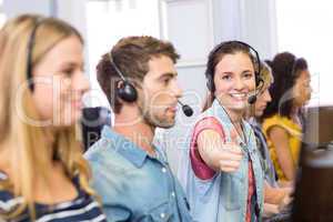 Students using headsets in computer class