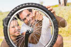 Father and son repairing bike together