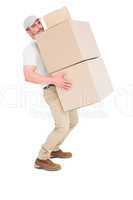 Tired delivery man carrying stack boxes