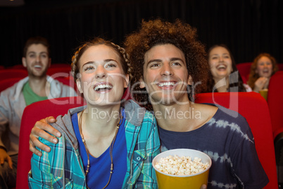 Young couple watching a film