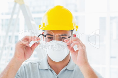 Handyman wearing protective eyewear at site