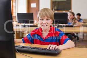 Cute pupil in computer class