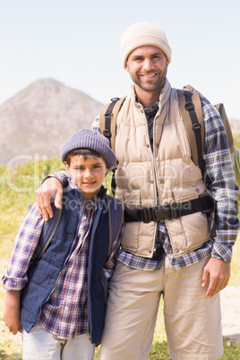 Father and son hiking in the mountains