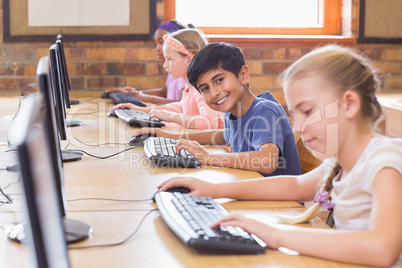 Cute pupils in computer class