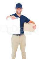 Delivery man with package giving clipboard for signature