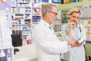 Pharmacist and customer talking about medication