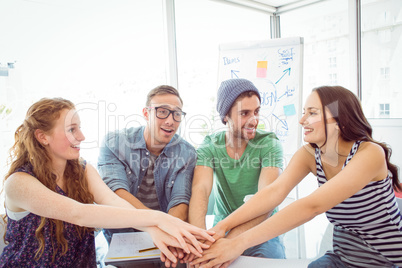 Fashion students high fiving together