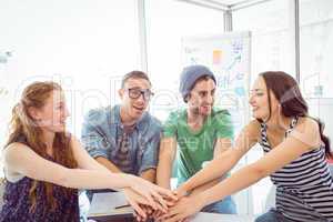 Fashion students high fiving together