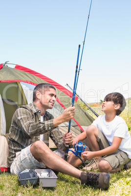 Father and son by their tent Father and son by their tent