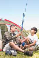 Father and son by their tent