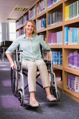 Smiling disabled student in library