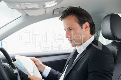 Businessman reading a map