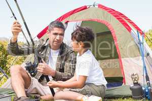 Father and son by their tent