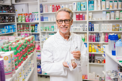 Pharmacist holding medicine blister pack