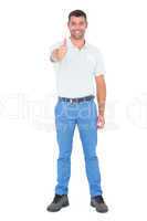 Portrait of confident handyman gesturing thumbs up