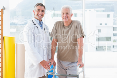 Senior man with therapist smiling at camera