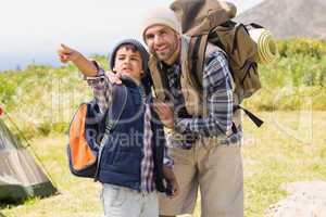 Father and son hiking in the mountains