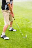 Golfer lining up his shot